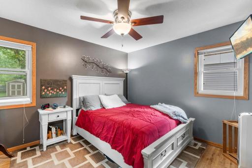 A nicely sized main-level bedroom offers comfortable everyday living and classic hardwood floors