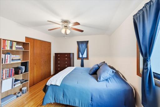 Comfortably sized for a king- or queen-size bed set, this bedroom serves as an excellent primary suite with direct access to a private bath.