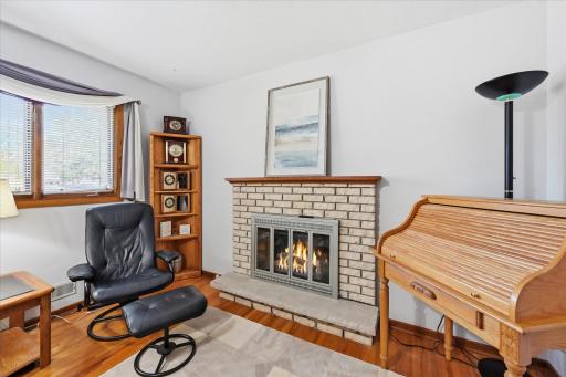 With its generous size, this room offers the perfect combination of comfort and functionality, featuring space for a cozy sitting area by the fireplace as well as a dedicated desk or home office setup. Windows are original in this room.