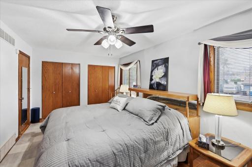 A spacious primary retreat with ample closet storage and enough room to comfortably accommodate a king-size bedroom set.