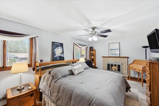 Originally the builder's own residence, this home offers an expansive bedroom which was created by combining two bedrooms into one generous living space, featuring an electric fireplace, dual closets, and plenty of room to relax.