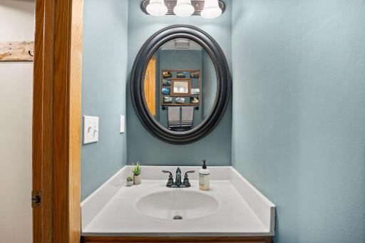 The main level bathroom off the hallway from the kitchen