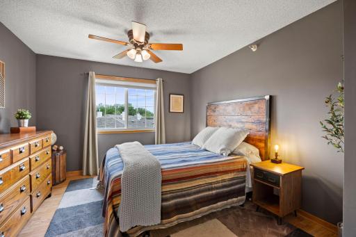 Upper level primary bedroom with attached walk in closet