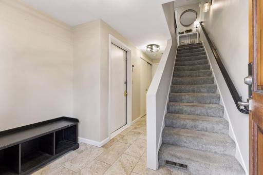 This is the front entry with stairs leading up to the main level living space.