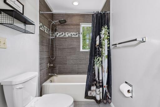 Nice tile shower in the primary bath 1