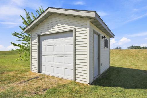 12'x14'(A) Storage Shed in the back yard (2016) has a concrete floor and electricity, even a remote garage door opener - great place to store and charge yard equipment and toys!