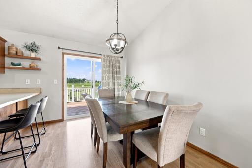 Dining Area with vaulted ceilings and access to the deck, overlooking the expansive back yard view!