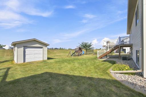 24'x24'(A) garage PLUS a 12'x14'(A) shed (2016) with concrete floor, and electric garage door opener in the back yard for all your yard equipment and toys.
