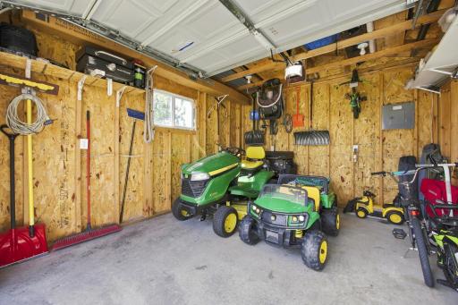 12'x14'(A) Storage Shed in the back yard (2016) has a concrete floor and electricity, even a remote garage door opener - great place to store and charge yard equipment and toys!