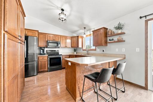 Well appointed Kitchen has updated black-stainless appliances (2018) and a pantry.
