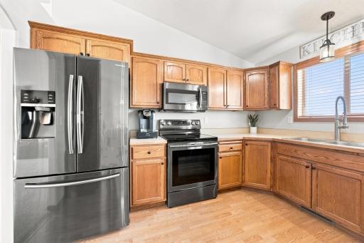 Well appointed Kitchen has updated black-stainless appliances (2018) and a pantry.
