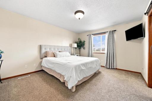 Large Primary Bedroom overlooks the back yard, and has an en suite bath and walk-in closet.