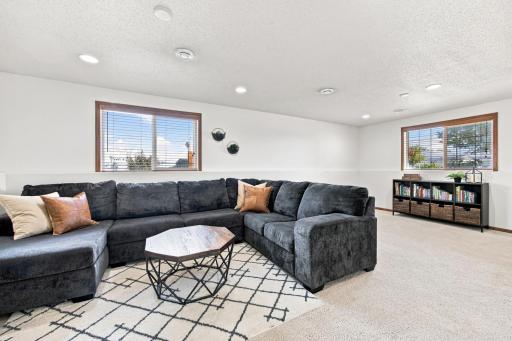 Large Family Room has gas fireplace and plenty of space for a card table, children's toys, etc!