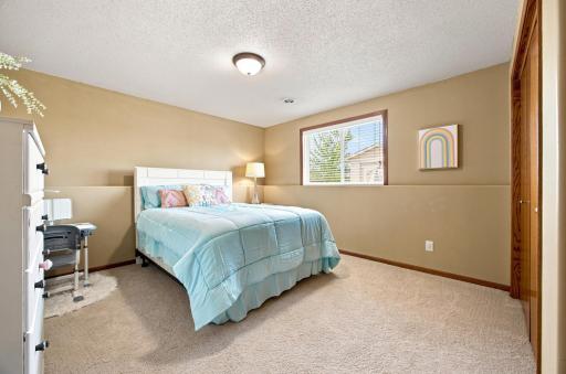 3rd (lower level) Bedroom is generous in size and looks out toward the back yard.