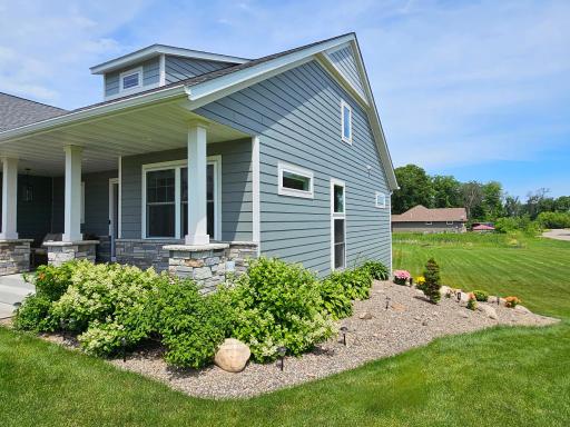 Landscaping features gorgeous blooming bushes, perennials & hostas! (Seller Photo)