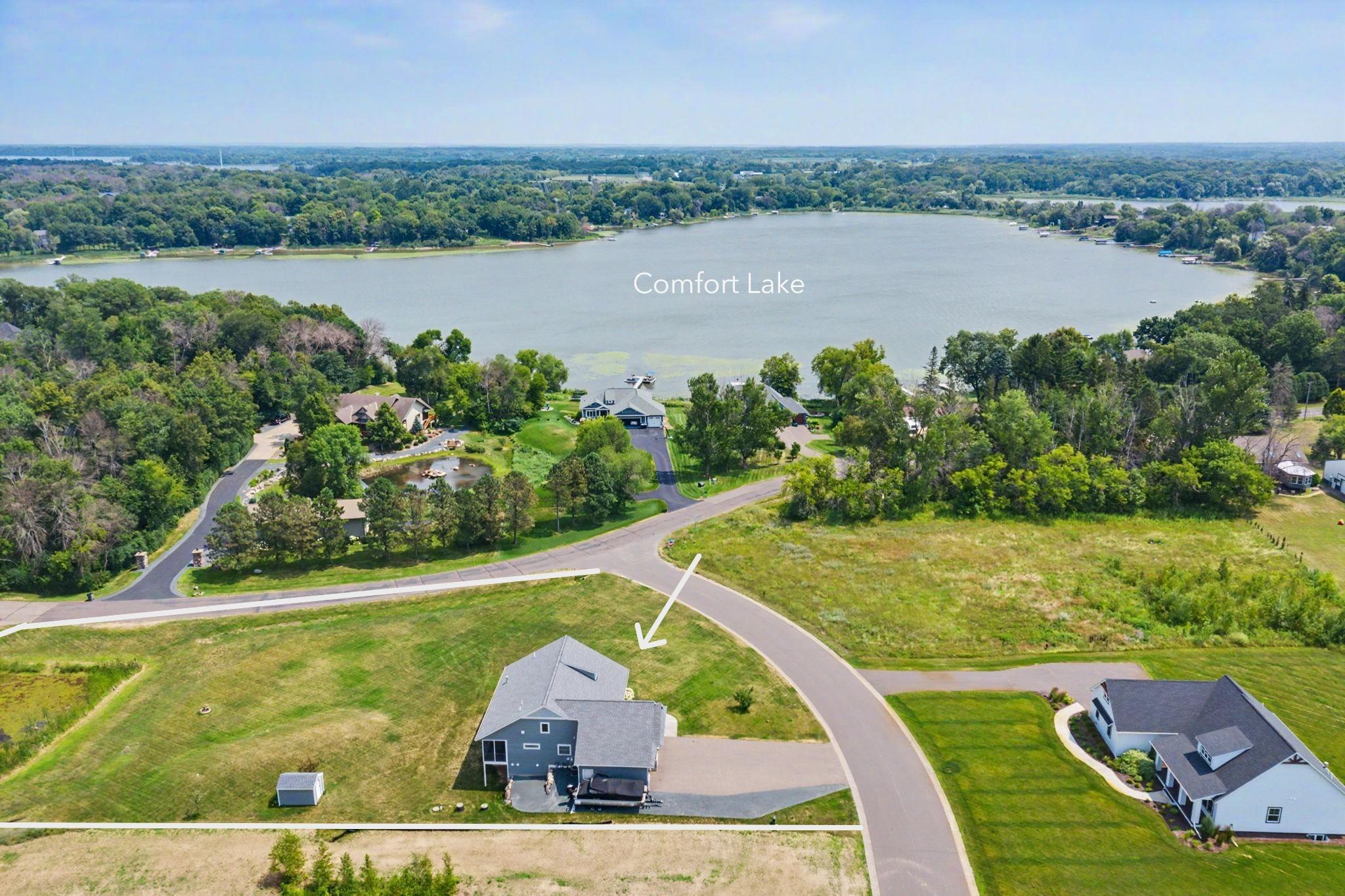 Situated on a 1.25-acre corner lot w/lake view!