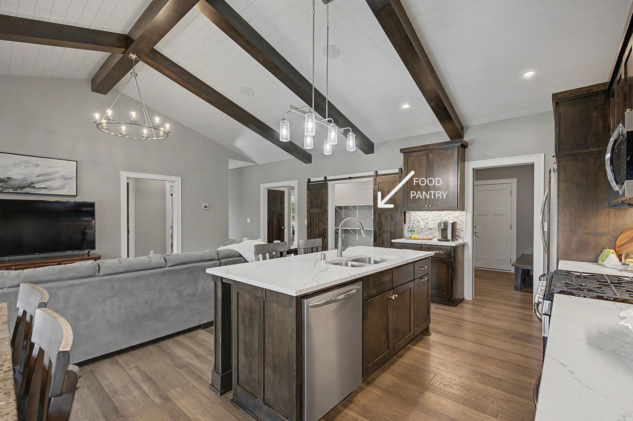 Behind that beautiful track door is a pantry to love!
