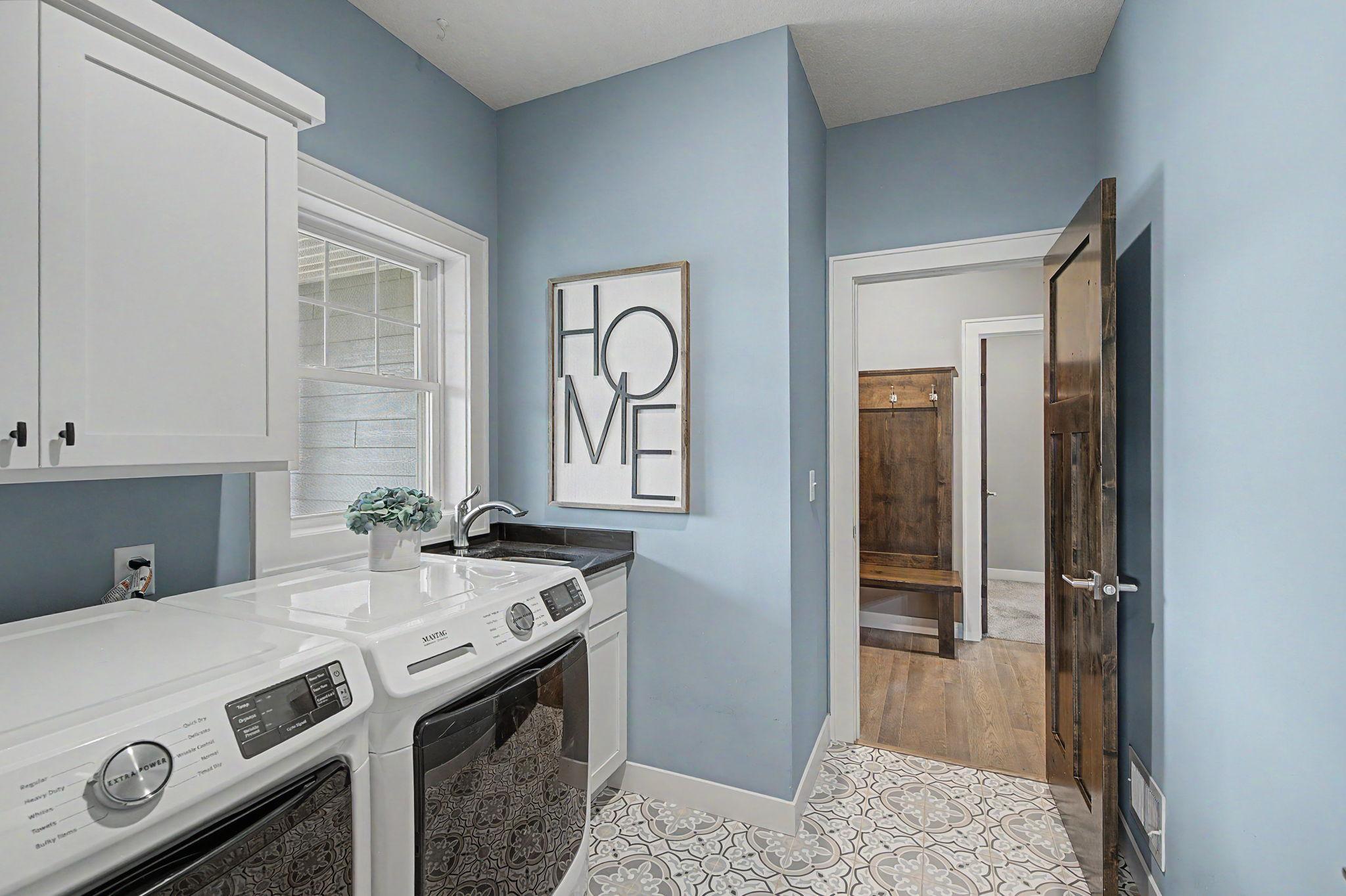 Dedicated laundry w/sink & window!