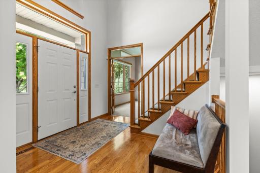 Soaring two-story foyer creates an impressive first impression. Refinished hardwood flooring adds warmth and character throughout the entry.