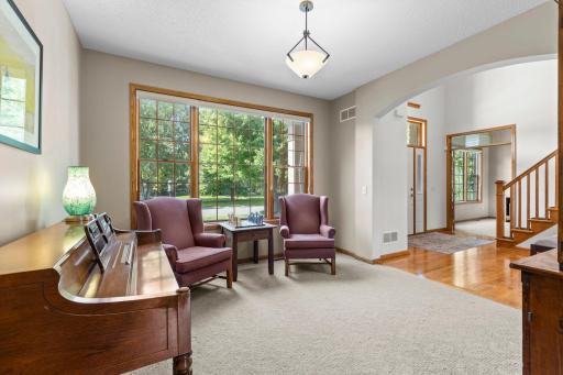 Versatile front room provides additional space for formal dining, music, or entertaining.