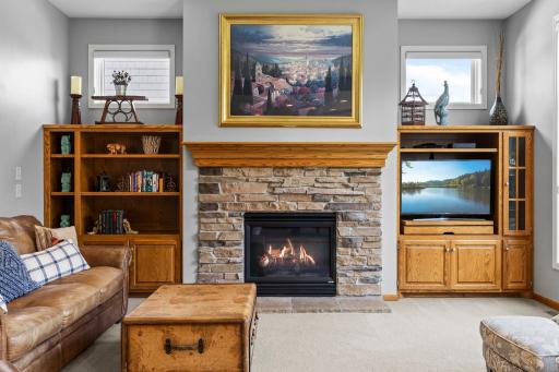 Stacked-stone gas fireplace creates an inviting focal point in the great room.