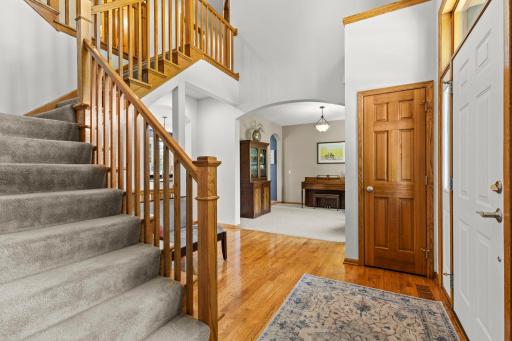 Inviting front entry surrounded by updated landscaping and mature greenery.