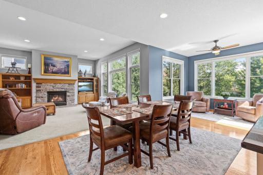 Open dining space flows seamlessly between the kitchen and sunroom. Generous dining area provides plenty of room for everyday meals and entertaining.