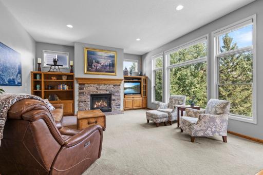 Spacious great room features 9-foot ceilings and custom built-in oak cabinetry.