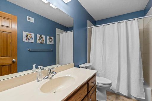 Ceramic tile tub and shower surround provides a durable and polished finish.