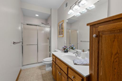Three-quarter bath adds convenience for guests and the surrounding recreation spaces.