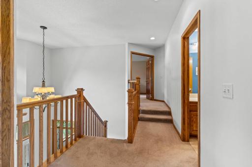 Beautiful mission-style oak railings provide a timeless architectural detail.