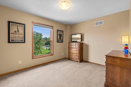 Three additional upper-level bedrooms provide comfortable and flexible living space.