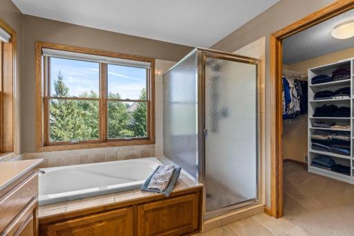 Updated tiled shower gives the primary bath a fresh, polished finish.