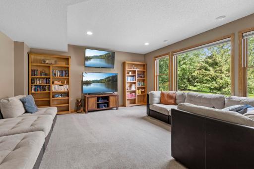 Vast lower-level family room provides plenty of space for multiple seating and entertainment areas. Plenty of room to create a dedicated home theater for movie nights and entertaining.