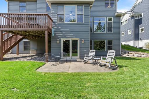Large deck extends the living space outdoors and overlooks the naturally screened yard. Flat backyard provides excellent space for outdoor activities, entertaining, or gardening.