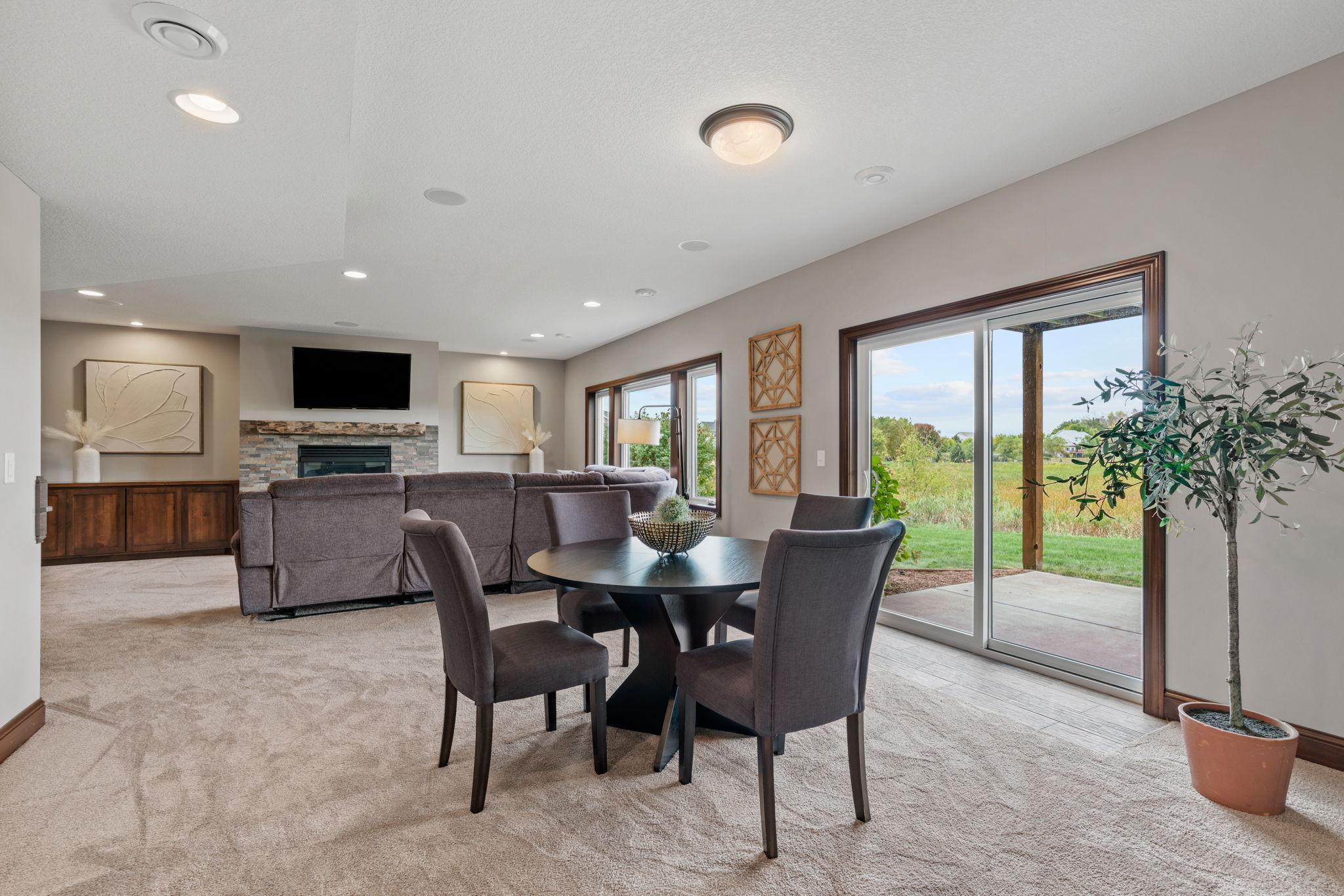 Finished walk-out LL offers another spacious Living Room w/ stone fireplace + built-ins, Gaming Area