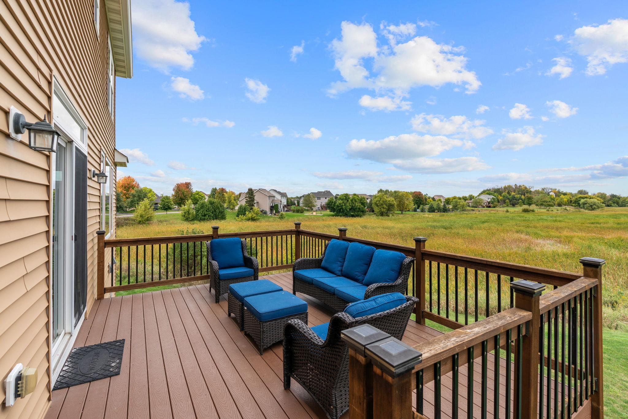 Walk out to a mntce-free deck w/ solar lighting overlooking the incredible backyard