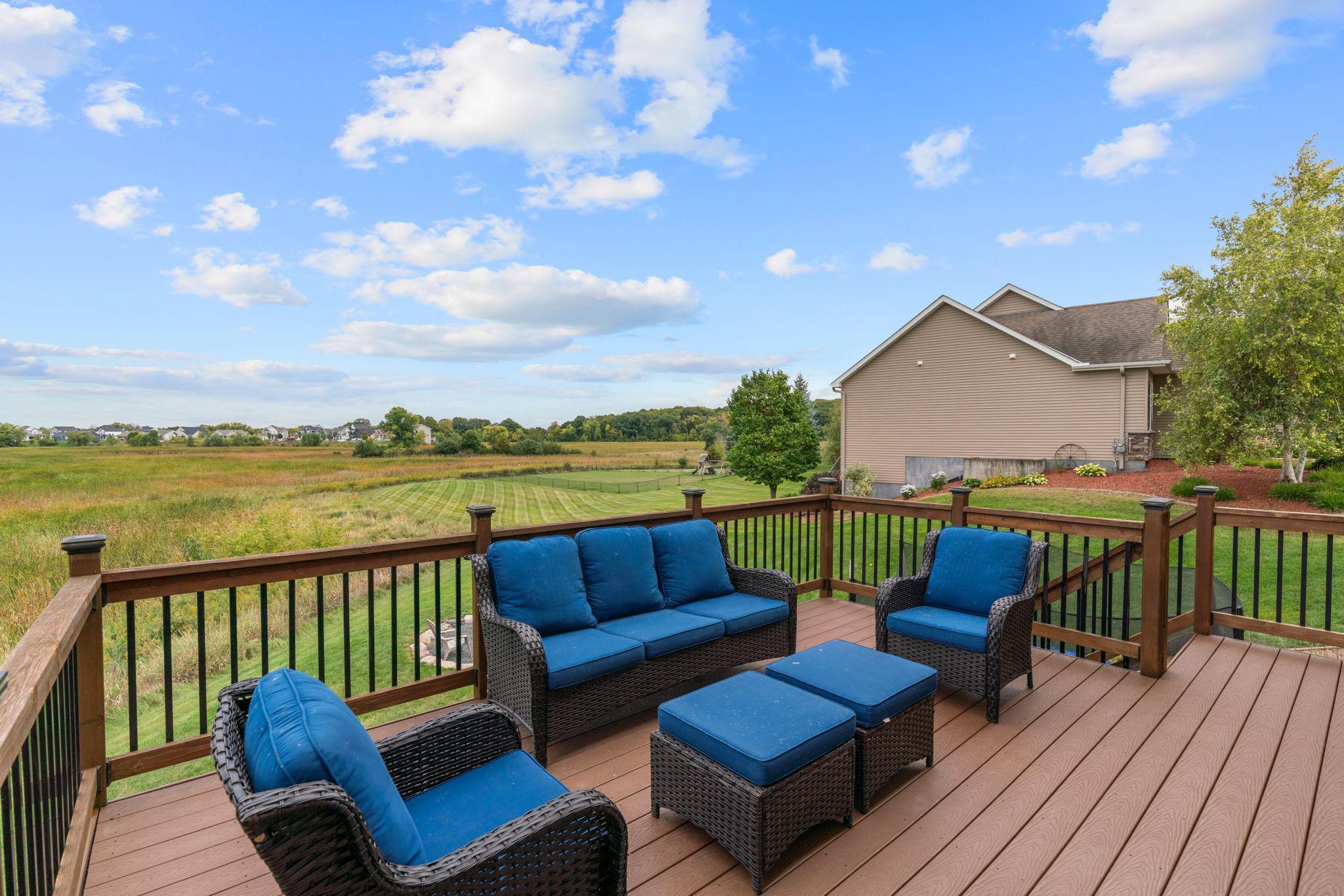 Walk out to a mntce-free deck w/ solar lighting overlooking the incredible backyard