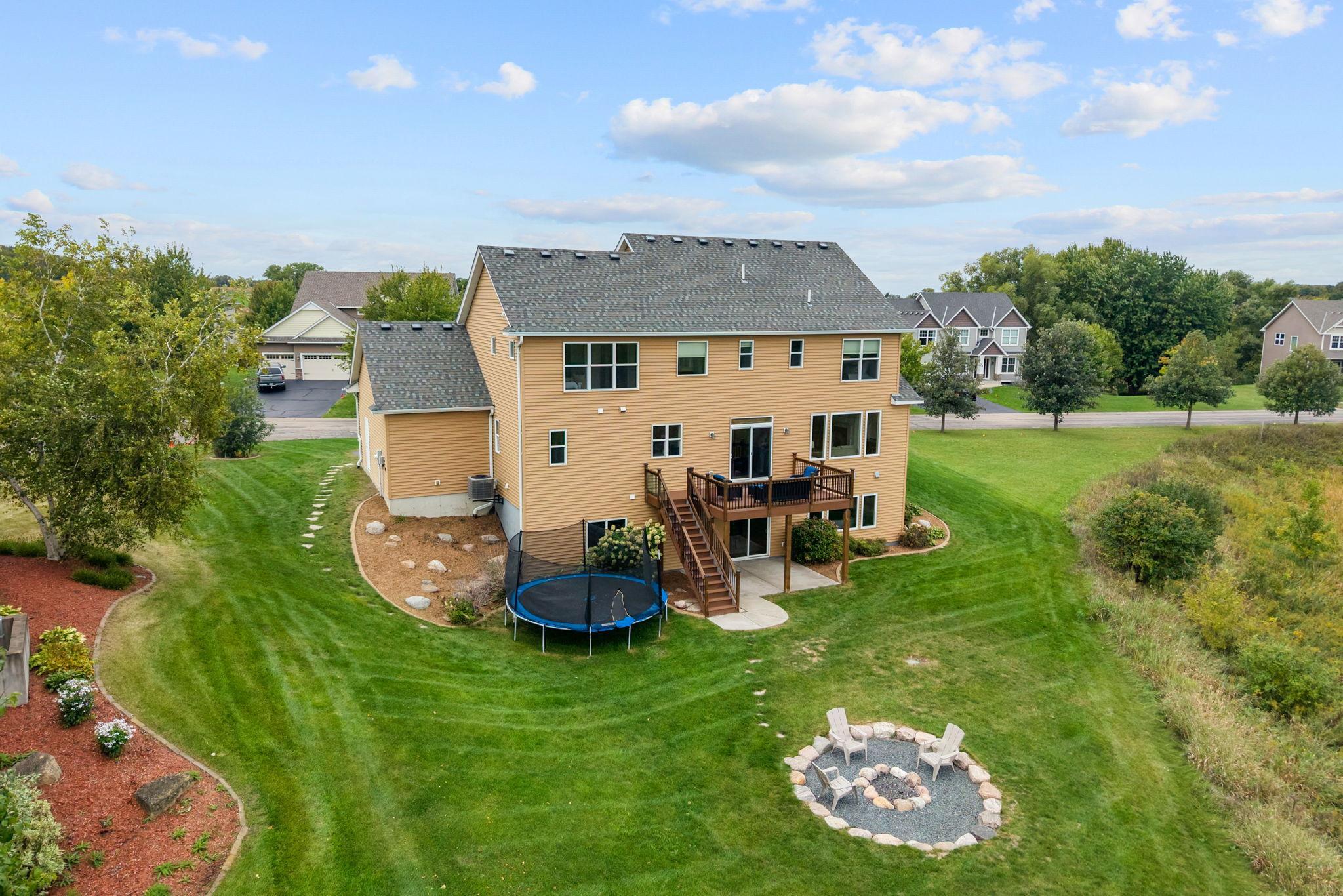Walk out to a mntce-free deck w/ solar lighting overlooking the incredible backyard