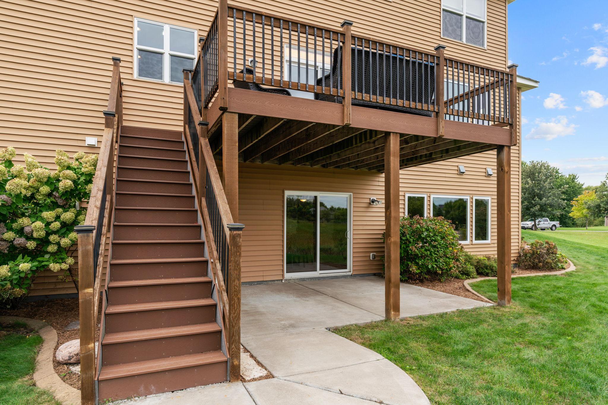 Walk out to the concrete patio + incredible backyard to enjoy campfires around the built-in fire pit