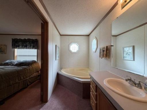 Primary bathroom with separate tub and shower