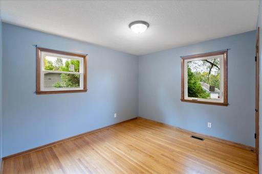 Another of three main-level bedrooms with beautiful flooring and plenty of windows.