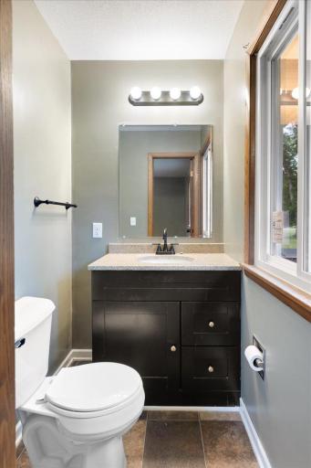 Convenient main-level half bath provides an additional bathroom for the 3-bedroom main-level residence.
