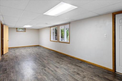 Welcome to the lower-level 2-bedroom residence, featuring a spacious living area with durable flooring and plenty of natural light.