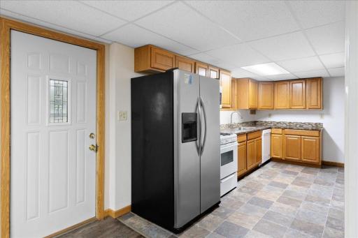 Lower-level residence features its own full kitchen and private exterior entranceâideal for separate living.