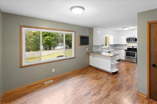 Main-level dining area flows directly into the kitchen, creating a comfortable and functional everyday living space.