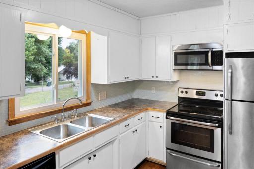 Plenty of workspace and storage in the main-level kitchen, plus a window above the sink overlooking the yard.