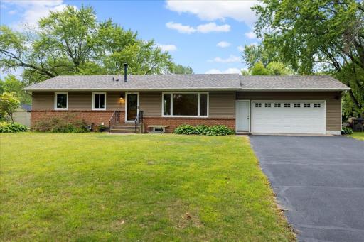 Main-level residence features its own driveway off Oak Circle along with the attached garage and private entrance.