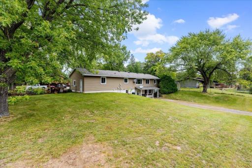 Lower-level residence offers excellent separation with its own private entrance and dedicated driveway accessed from Birch Street.
