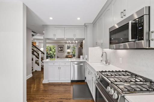 This kitchen is well appointed with abundant cabinetry, pull out shelves for easy storage, and counter top seating